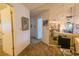 Long hallway with mirrored wall and carpet flooring at 3851 Wilshire Dr # 9, Sarasota, FL 34238