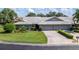 Two-story house with a tile roof and attached two-car garage at 3851 Wilshire Dr # 9, Sarasota, FL 34238