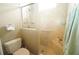 Clean bathroom with toilet and shower stall at 114 147Th Ne St, Bradenton, FL 34212