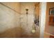 Large walk-in shower with tiled walls and built-in shelving at 114 147Th Ne St, Bradenton, FL 34212