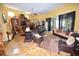 Large living room with ample seating, built-in shelving, and fireplace at 2107 89Th St Nw, Bradenton, FL 34209