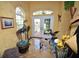 Bright entryway with tile floor, French doors, and unique decor at 2107 89Th St Nw, Bradenton, FL 34209