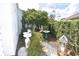 Charming side yard with stone pathway, fountain, and lush landscaping at 2107 89Th St Nw, Bradenton, FL 34209