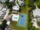 Aerial view showing a home with private pool and tennis court at 2107 89Th St Nw, Bradenton, FL 34209
