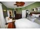 Large bedroom with hardwood floors and a ceiling fan at 2107 89Th St Nw, Bradenton, FL 34209