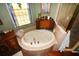 Close-up view of a luxurious soaking tub with copper fixtures at 2107 89Th St Nw, Bradenton, FL 34209