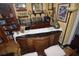 Elegant wet bar with granite top, custom cabinetry, and wine storage at 2107 89Th St Nw, Bradenton, FL 34209