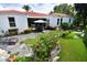 Large backyard with flagstone patio and lush landscaping at 2107 89Th St Nw, Bradenton, FL 34209
