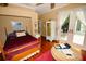 Guest bedroom with hardwood floors and access to private patio at 2107 89Th St Nw, Bradenton, FL 34209