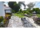 Spacious backyard with flagstone patio and lush gardens at 2107 89Th St Nw, Bradenton, FL 34209