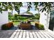 Landscaped backyard with patio furniture and umbrella at 2107 89Th St Nw, Bradenton, FL 34209