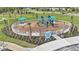 Fenced playground with play structures and seating at 6231 Dry Tortugas Dr, Sarasota, FL 34241