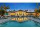 Evening view of community pool and clubhouse at 6231 Dry Tortugas Dr, Sarasota, FL 34241