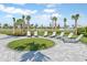 Relaxing poolside lounge area with palm trees at 6231 Dry Tortugas Dr, Sarasota, FL 34241