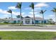 Community clubhouse with palm trees and a welcoming entrance at 6231 Dry Tortugas Dr, Sarasota, FL 34241