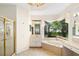 Spacious bathroom with corner bathtub, shower, and double vanity at 7335 Saint Georges Way, University Park, FL 34201