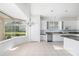 Eat-in kitchen with granite countertops and ample cabinet space at 7335 Saint Georges Way, University Park, FL 34201