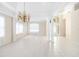 Spacious dining room featuring tile floors and chandelier at 7335 Saint Georges Way, University Park, FL 34201