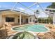 Spacious pool and spa area with screened enclosure at 7335 Saint Georges Way, University Park, FL 34201