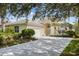 House exterior featuring a two-car garage and landscaping at 7335 Saint Georges Way, University Park, FL 34201
