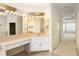 Bathroom with large vanity and access to bedroom and other bathroom areas at 7335 Saint Georges Way, University Park, FL 34201