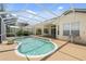 Relaxing kidney-shaped pool with a screened enclosure at 7335 Saint Georges Way, University Park, FL 34201