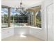 Kitchen with breakfast nook overlooking the pool and spa at 7335 Saint Georges Way, University Park, FL 34201