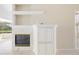Living room fireplace with built-in cabinetry at 7335 Saint Georges Way, University Park, FL 34201