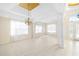 Sunlit dining room showcasing tile floors and a chandelier at 7335 Saint Georges Way, University Park, FL 34201