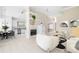 Open concept living room and kitchen with neutral decor and tile flooring at 7335 Saint Georges Way, University Park, FL 34201