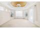Spacious bedroom with tray ceiling, window seat, and ample natural light at 7335 Saint Georges Way, University Park, FL 34201