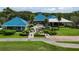 Aerial view of a country club with a spacious clubhouse and outdoor seating at 7335 Saint Georges Way, University Park, FL 34201