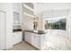 Eat-in kitchen with white cabinets, granite countertops and breakfast bar at 7335 Saint Georges Way, University Park, FL 34201