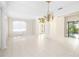 Bright dining room with tile floors and a chandelier at 7335 Saint Georges Way, University Park, FL 34201