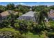 Aerial view of home with pool and lush landscaping at 7335 Saint Georges Way, University Park, FL 34201