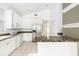 Kitchen boasts granite countertops, white cabinets, and stainless steel appliances at 7335 Saint Georges Way, University Park, FL 34201