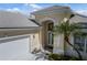 House exterior showcasing a front entrance and landscaping at 7335 Saint Georges Way, University Park, FL 34201