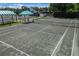 An aerial view of a single tennis court at 7335 Saint Georges Way, University Park, FL 34201