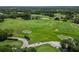 Aerial view of lush green golf course and fairways at 7335 Saint Georges Way, University Park, FL 34201