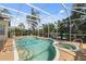 Large screened-in pool and spa with plenty of patio space at 7335 Saint Georges Way, University Park, FL 34201