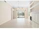 Bright living room with tile floors, fireplace, and sliding doors to pool area at 7335 Saint Georges Way, University Park, FL 34201
