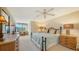 Main bedroom with a king-size bed and large windows at 826 Bayport Way # 826, Longboat Key, FL 34228