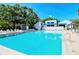 Refreshing community pool area with relaxing seating at 826 Bayport Way # 826, Longboat Key, FL 34228