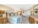 Spacious bedroom with a comfortable bed and ample dresser space at 826 Bayport Way # 826, Longboat Key, FL 34228