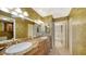 Elegant bathroom with granite countertops and updated fixtures at 826 Bayport Way # 826, Longboat Key, FL 34228