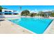 Inviting community pool with plenty of lounge chairs at 826 Bayport Way # 826, Longboat Key, FL 34228