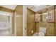 Convenient half bathroom with toilet and storage cabinet at 826 Bayport Way # 826, Longboat Key, FL 34228