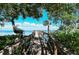 Expansive wooden pier extending over calm waters at 826 Bayport Way # 826, Longboat Key, FL 34228