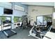 Well-equipped fitness center featuring treadmills, weight machines, and stationary bikes at 826 Bayport Way # 826, Longboat Key, FL 34228