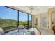 Bright dining area with glass table and chairs, offering scenic views at 826 Bayport Way # 826, Longboat Key, FL 34228
